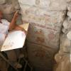 Archaeologist and painter Pedro Neciosup illustrates a painted pillar at Pañamarca